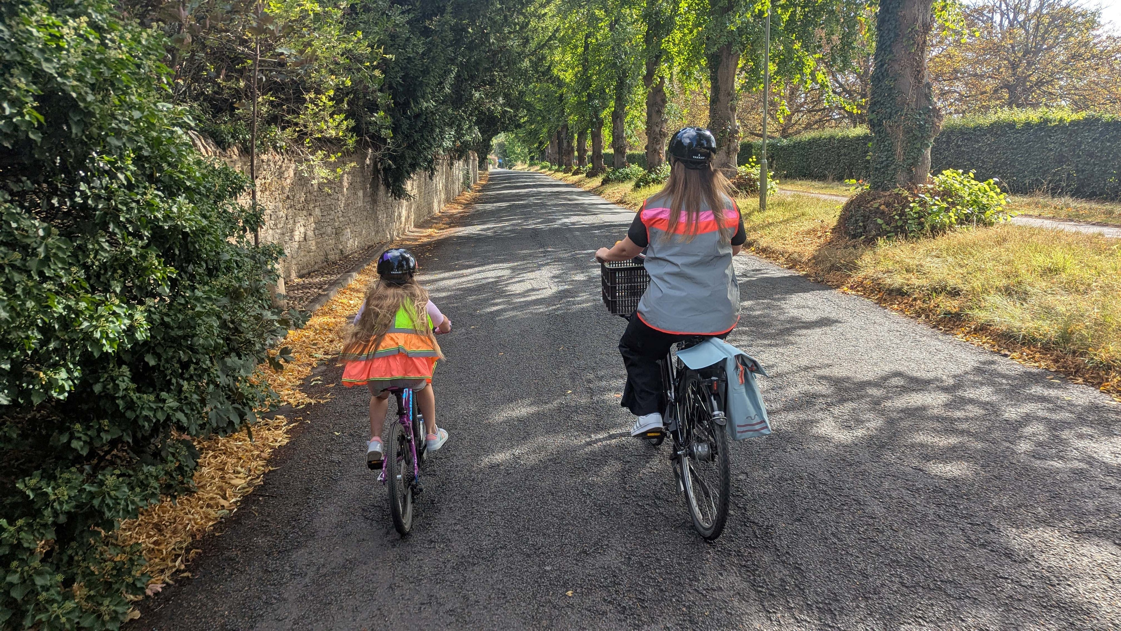 VeloVibe.co.uk mum & daughter cycling wearing Yakkay helmets and GoFluo Bodyglowers Wabelight and Grace