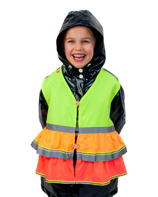 Child wearing a multicolored vest with reflective stripes on a white background