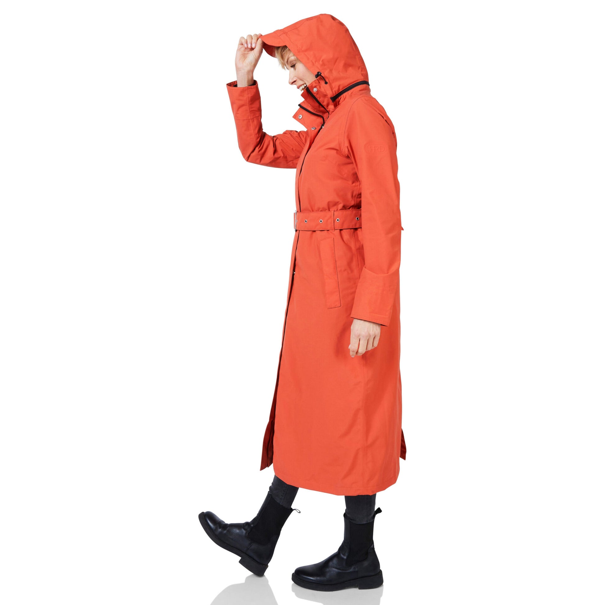 Person wearing an orange raincoat on a white background