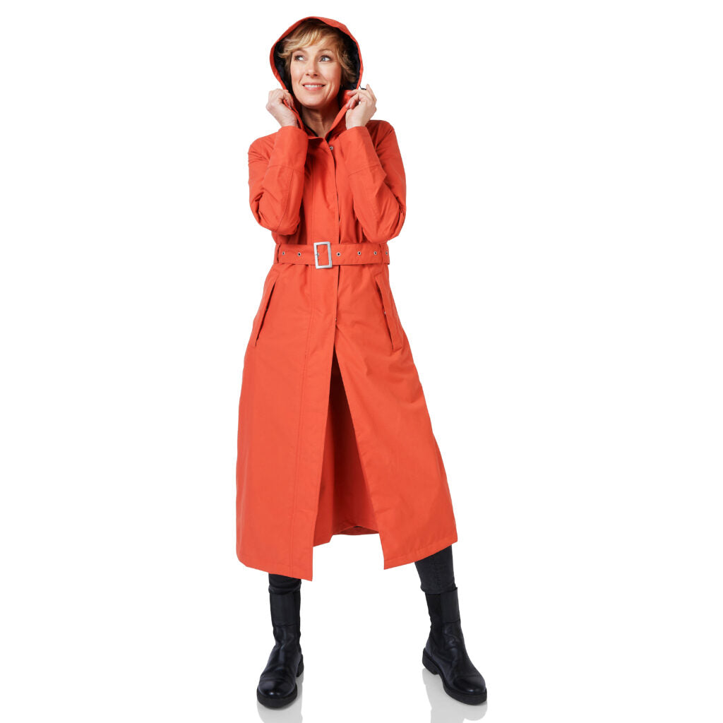 Person wearing a red raincoat on a white background