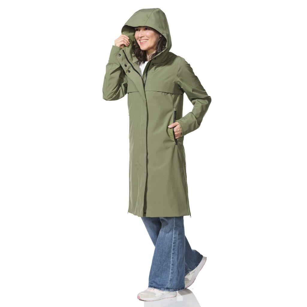 Person wearing a green raincoat on a white background