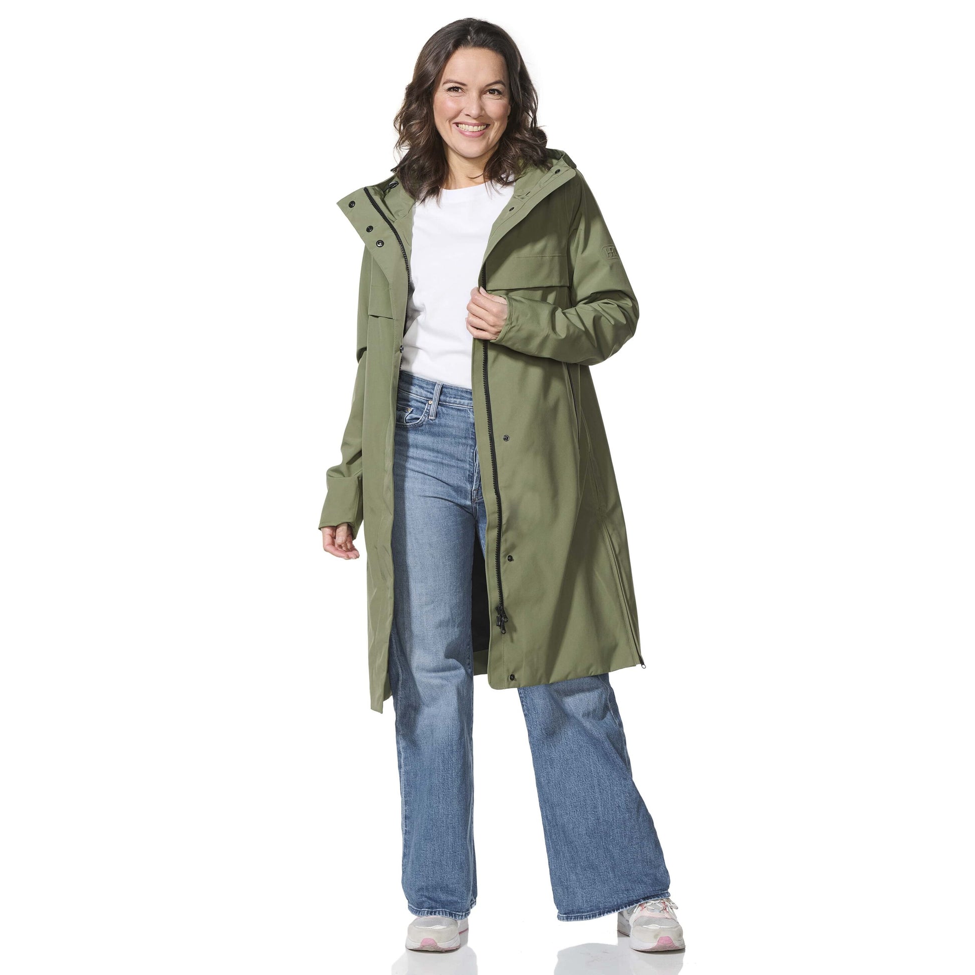 Woman wearing a green coat on a white background