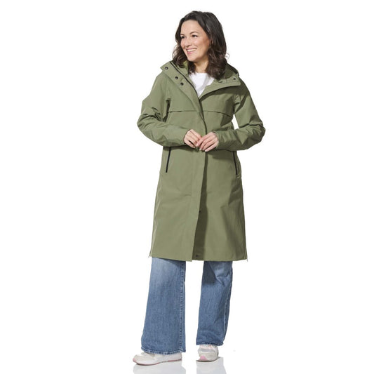 Woman wearing a green raincoat on a white background
