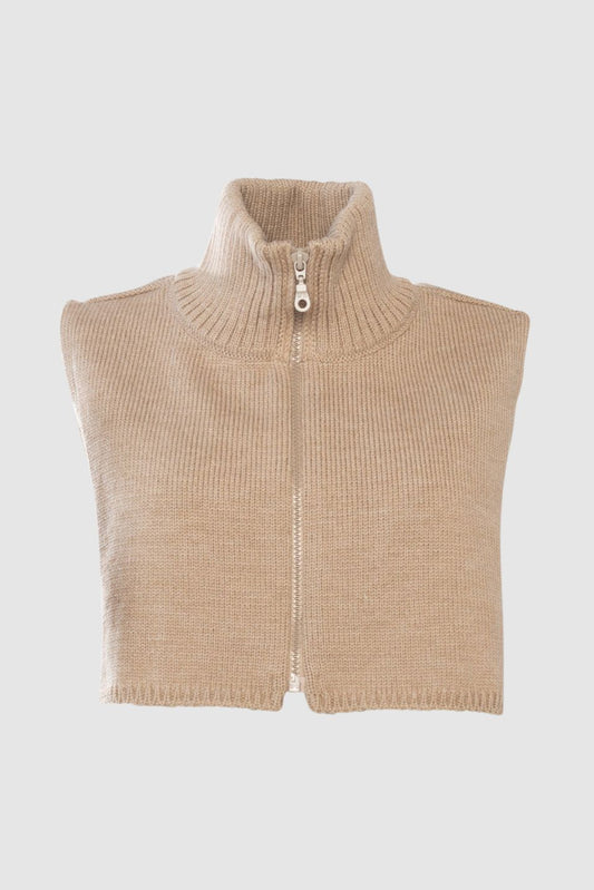 Beige knitted snood with a zipper on a light grey background