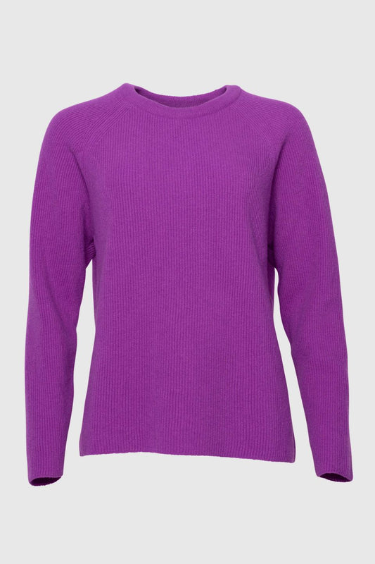 Purple sweater on a light gray background